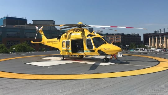 Dorset and Somerset Air Ambulance AW169 yellow helicopter at southampton hospital helipad